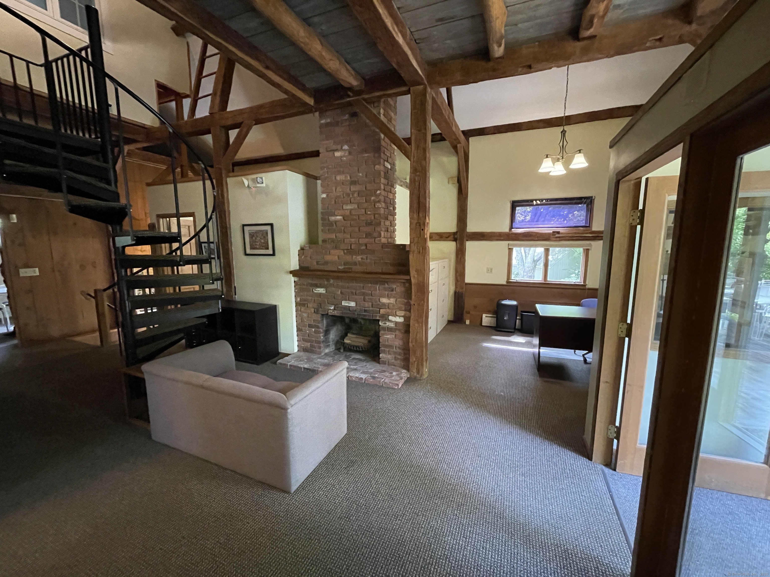 167 Baxter Road Mansfield, CT 06268 - Photo 9 of 22 a living room with furniture and a fireplace