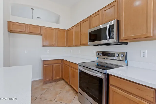 a kitchen with a sink and large window