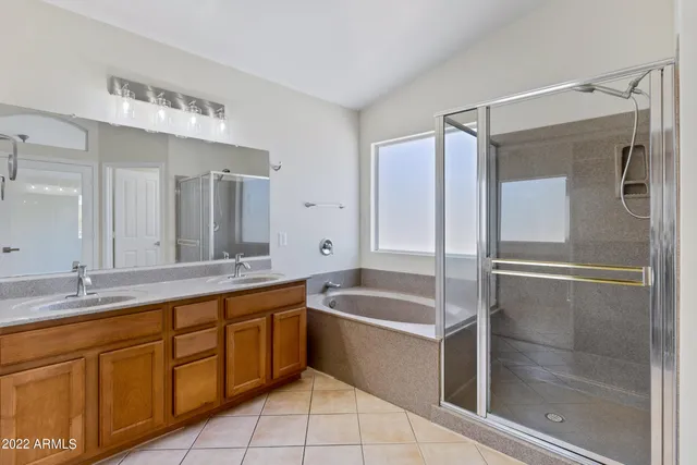 a bathroom with a shower and mirror