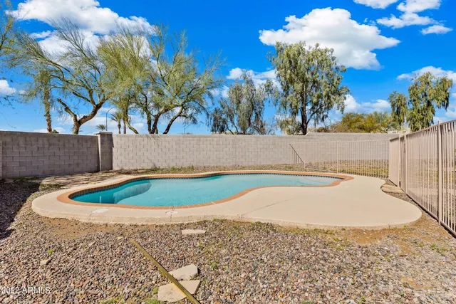 a view of a backyard of the house