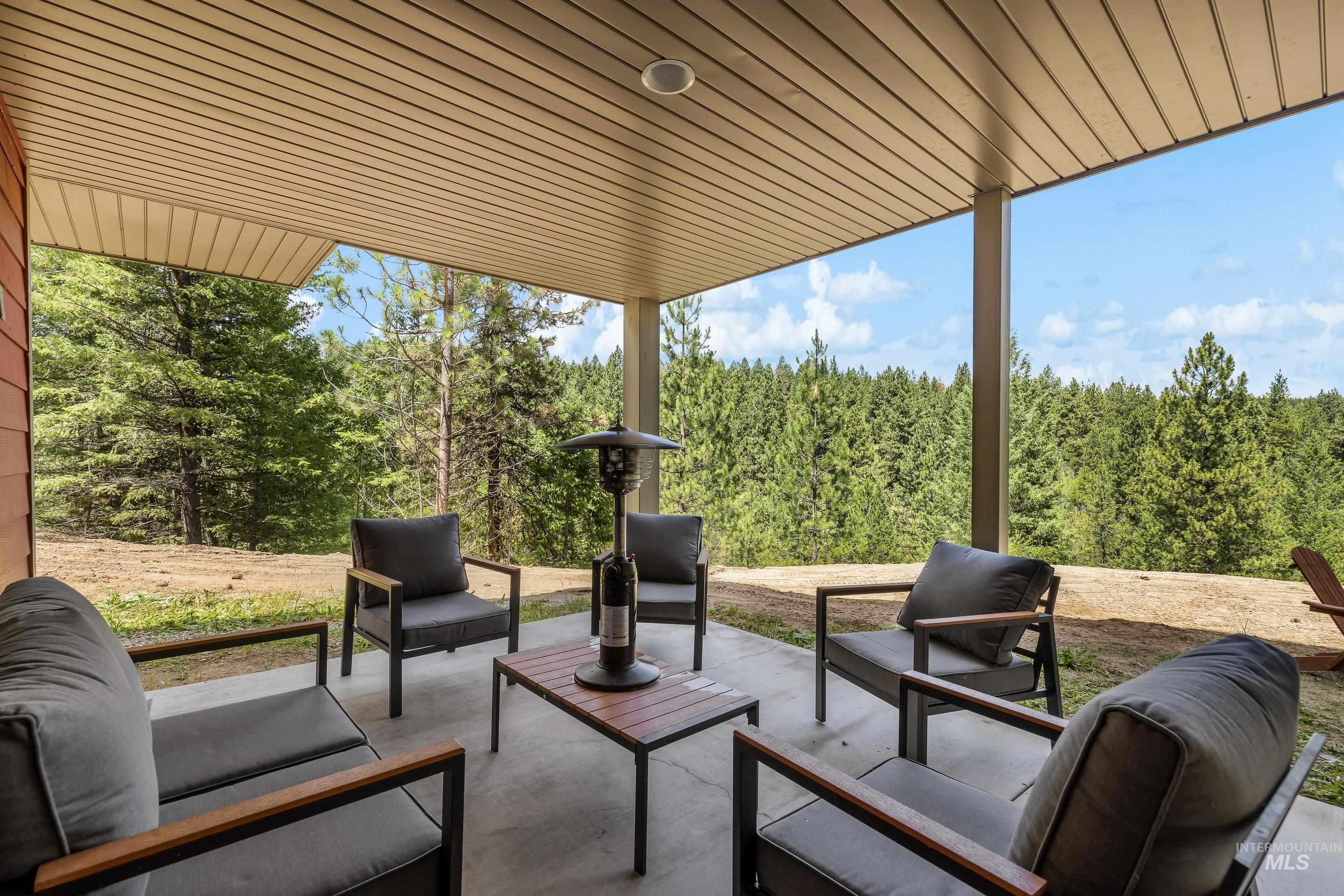 92 Cruickshank Road Horseshoe Bend, ID 83629 - Photo 45 of 50 Covered patio featuring a concrete surface and a wood-finish ceiling
