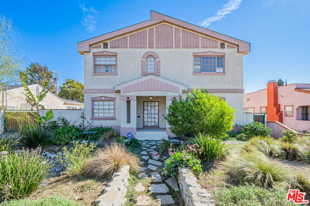 318 East Fairview Boulevard Inglewood, CA 90302 - Photo 1 of 45 a front view of a house with a yard