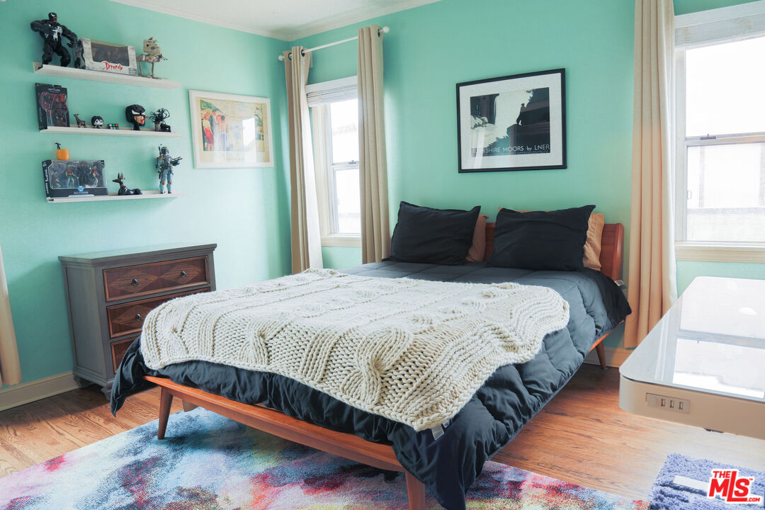 318 East Fairview Boulevard Inglewood, CA 90302 - Photo 15 of 45 a bed sitting in a bedroom next to a window