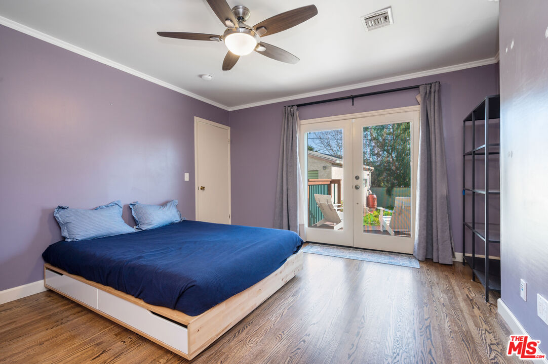 318 East Fairview Boulevard Inglewood, CA 90302 - Photo 18 of 45 a bedroom with a large bed and a large window