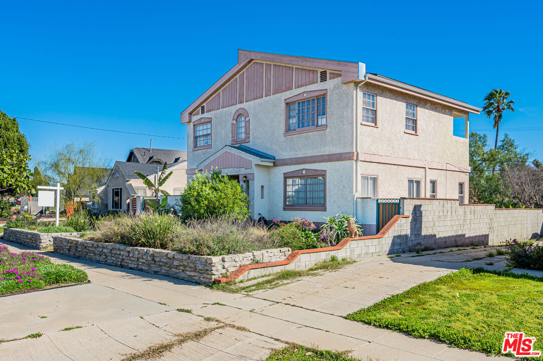 318 East Fairview Boulevard Inglewood, CA 90302 - Photo 2 of 45 a front view of a house with a yard