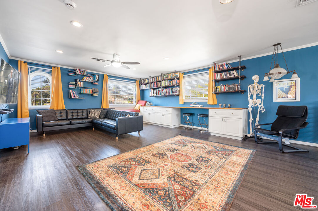 318 East Fairview Boulevard Inglewood, CA 90302 - Photo 25 of 45 a living room with furniture and a wooden floor