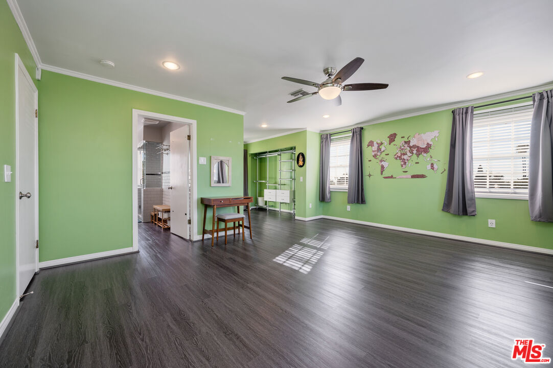 318 East Fairview Boulevard Inglewood, CA 90302 - Photo 31 of 45 a view of empty room with wooden floor and fan