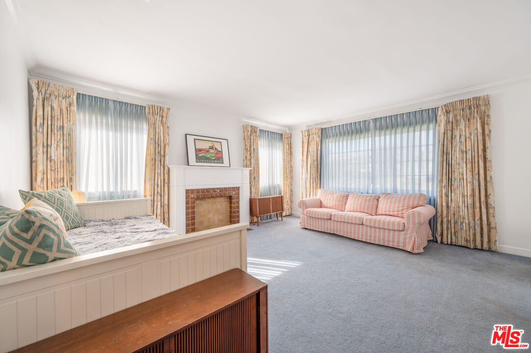318 East Fairview Boulevard Inglewood, CA 90302 - Photo 5 of 45 a living room with furniture and a fireplace