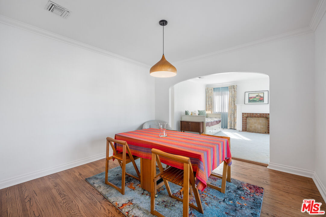 318 East Fairview Boulevard Inglewood, CA 90302 - Photo 8 of 45 a room with a table and a chandelier