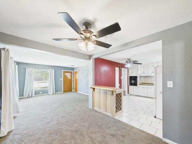 a view of livingroom with kitchen view and furniture
