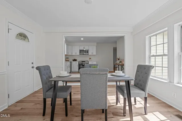 a view of a dining room with furniture window and outside view
