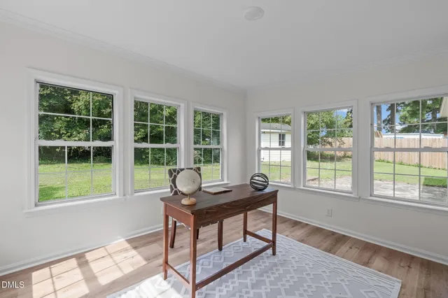 a work room with furniture and a window