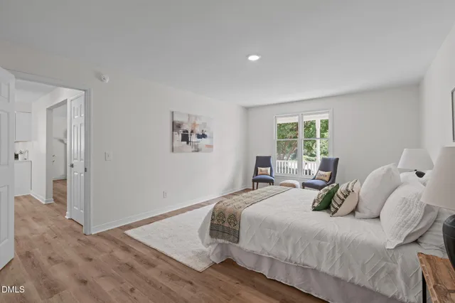 a bedroom with a bed and a couch