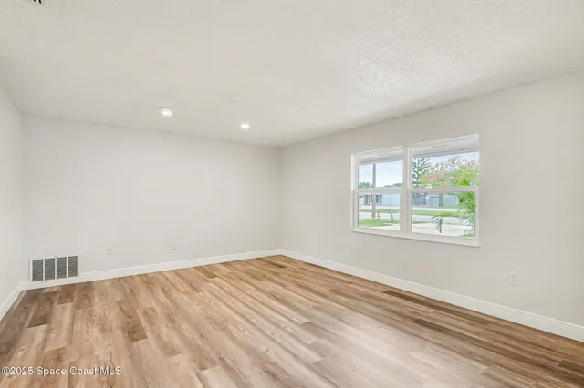 an empty room with windows