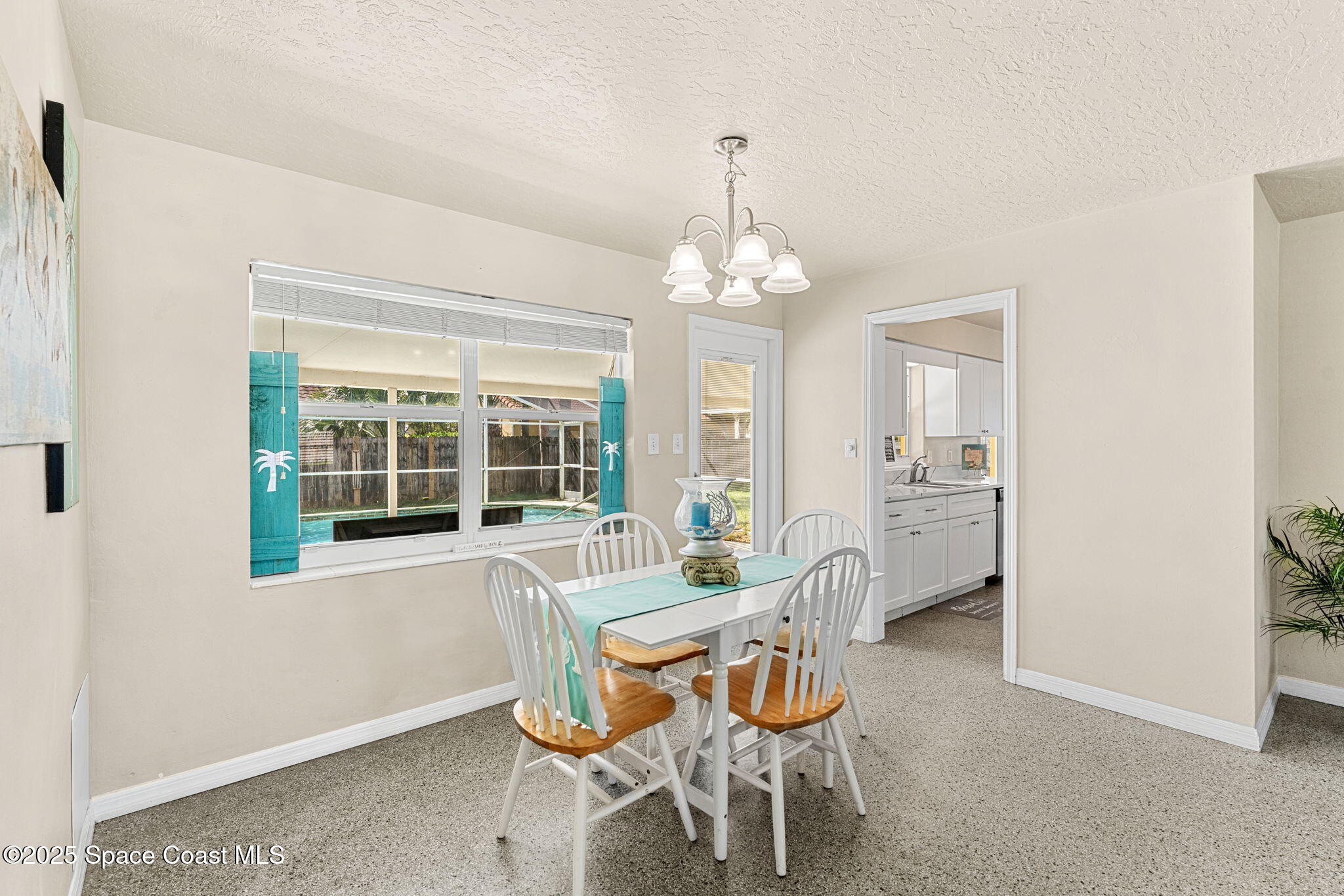 141 Diane Circle Indialantic, FL 32903 - Photo 14 of 36 a view of a dining room with furniture and chandelier