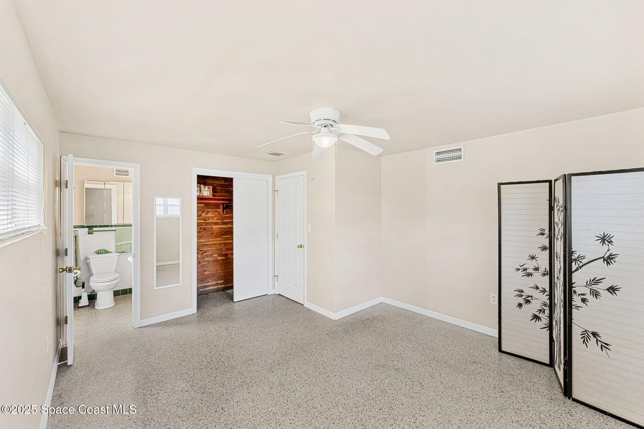 141 Diane Circle Indialantic, FL 32903 - Photo 17 of 36 wooden floor and windows in a room