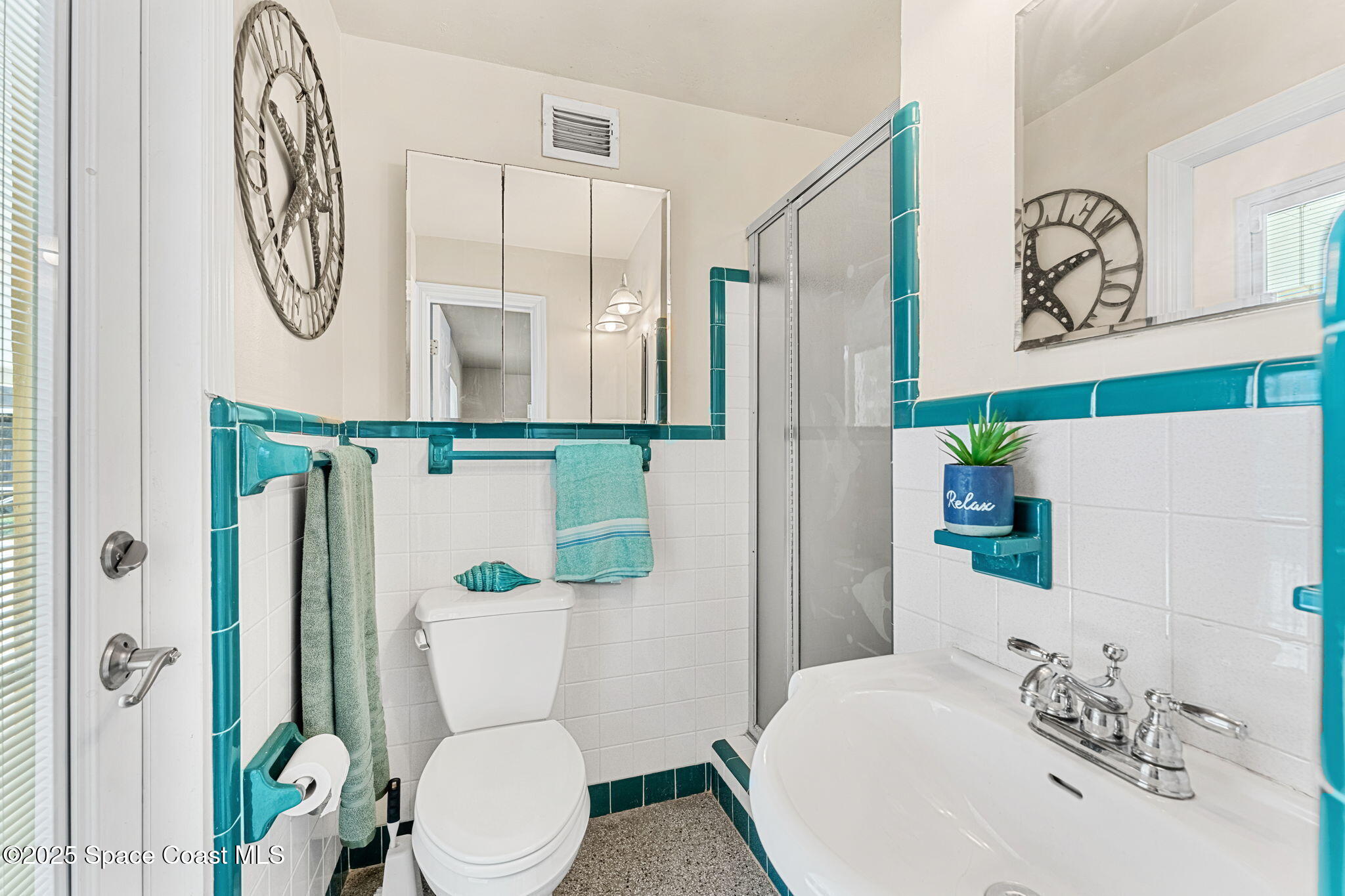 141 Diane Circle Indialantic, FL 32903 - Photo 18 of 36 a bathroom with a toilet and a sink