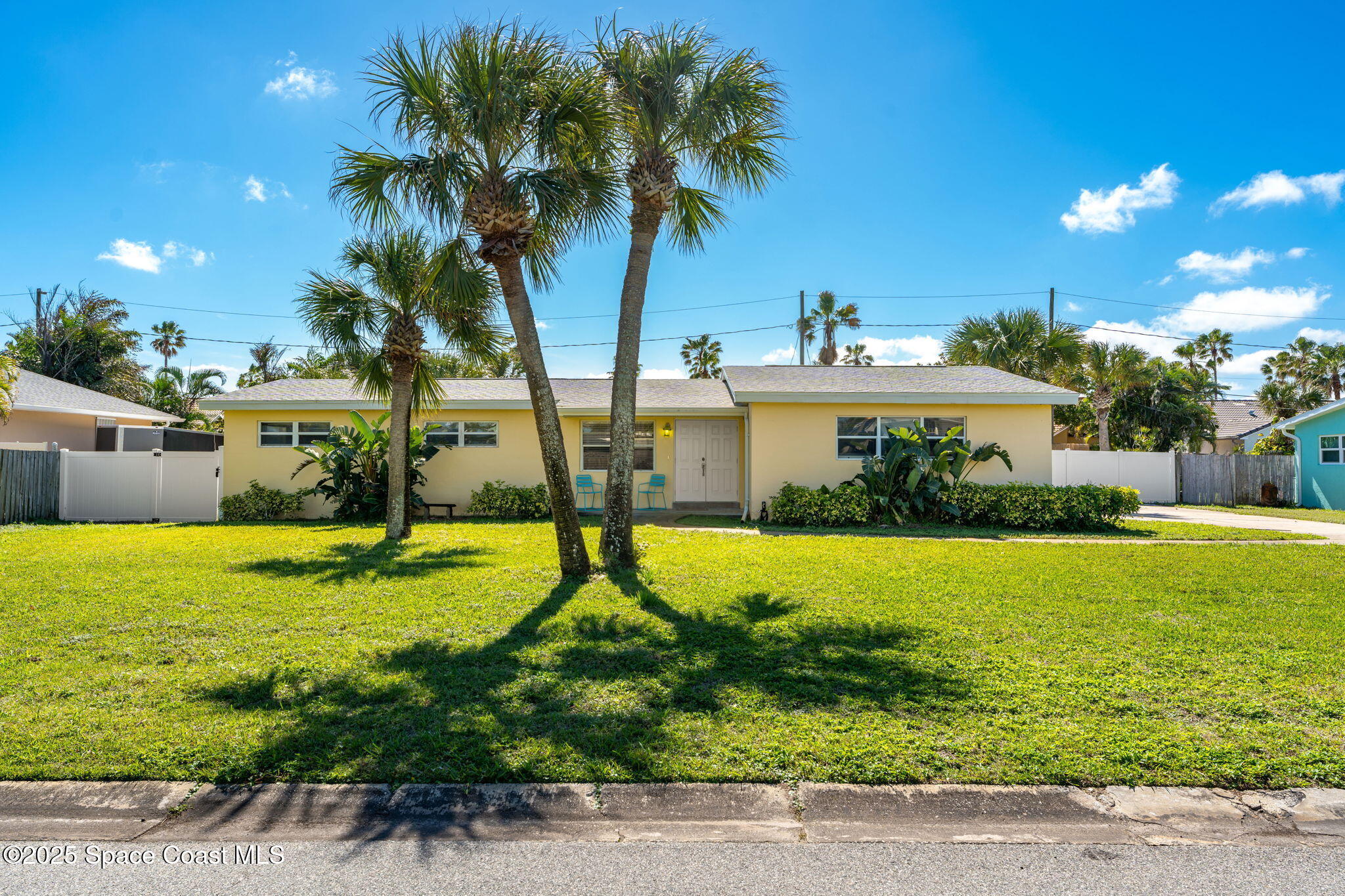 141 Diane Circle Indialantic, FL 32903 - Photo 3 of 36 a view of a backyard house and large trees