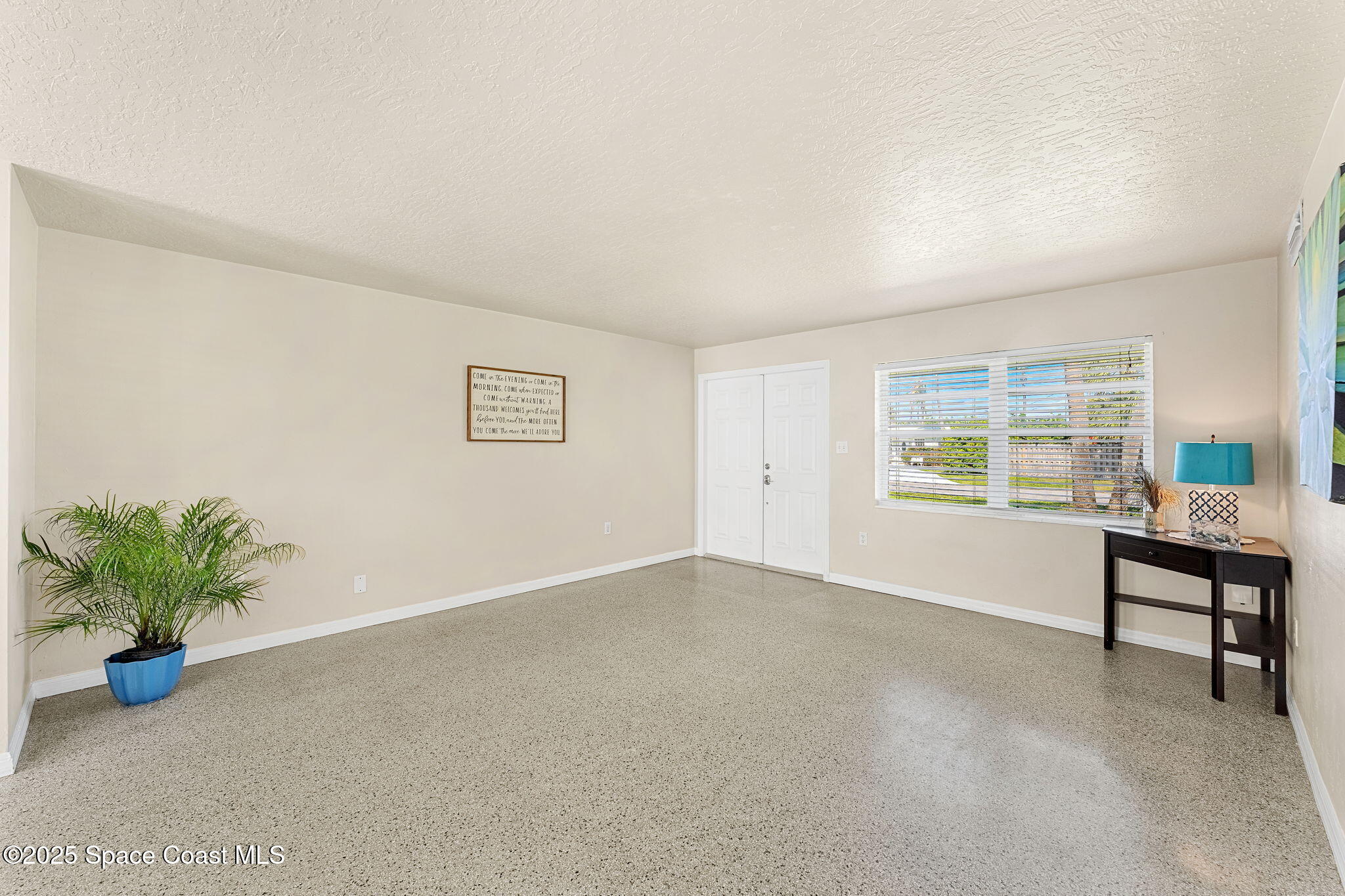 141 Diane Circle Indialantic, FL 32903 - Photo 7 of 36 a view of an empty room with a window