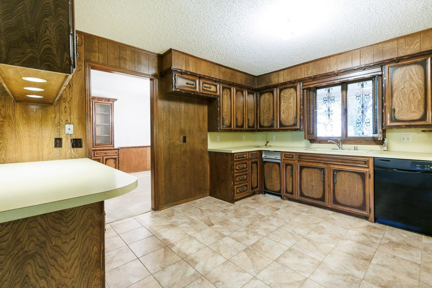 3402 79th Street Lubbock, TX 79423 - Photo 12 of 49 a kitchen with stainless steel appliances granite countertop a stove a sink and a refrigerator