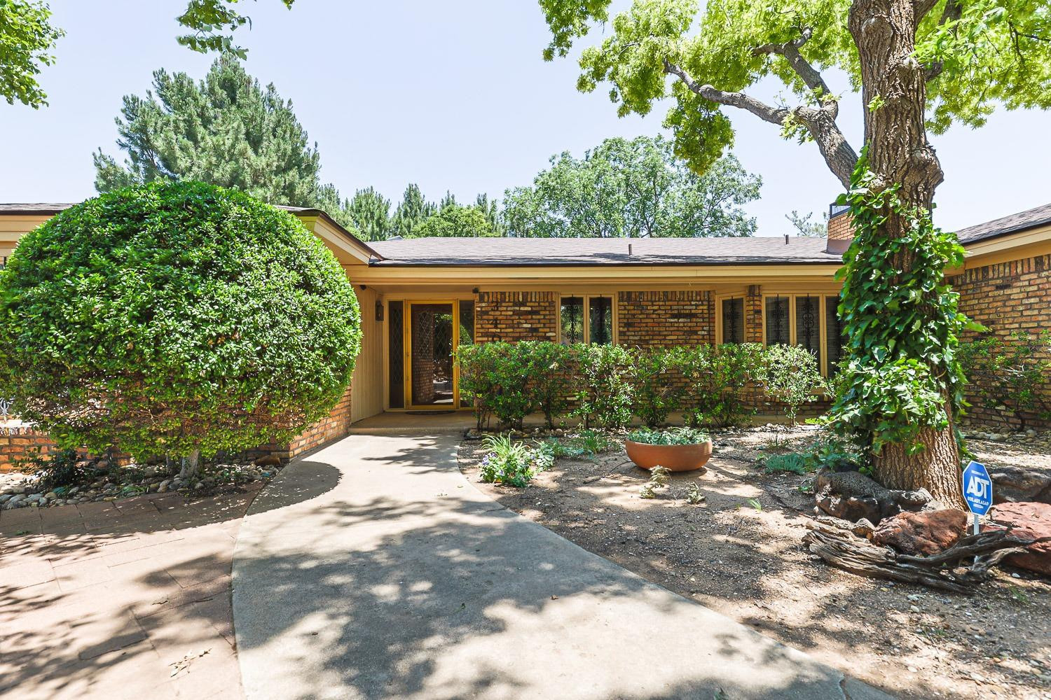 3402 79th Street Lubbock, TX 79423 - Photo 2 of 49 a view of a house with a yard