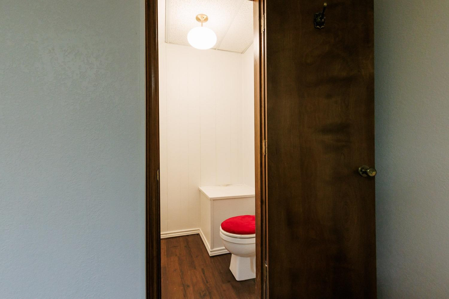 3402 79th Street Lubbock, TX 79423 - Photo 21 of 49 a bathroom with a sink and toilet