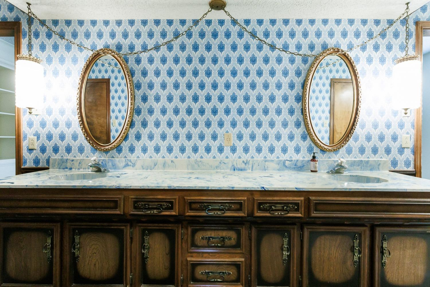 3402 79th Street Lubbock, TX 79423 - Photo 25 of 49 a bathroom with a sink and a mirror