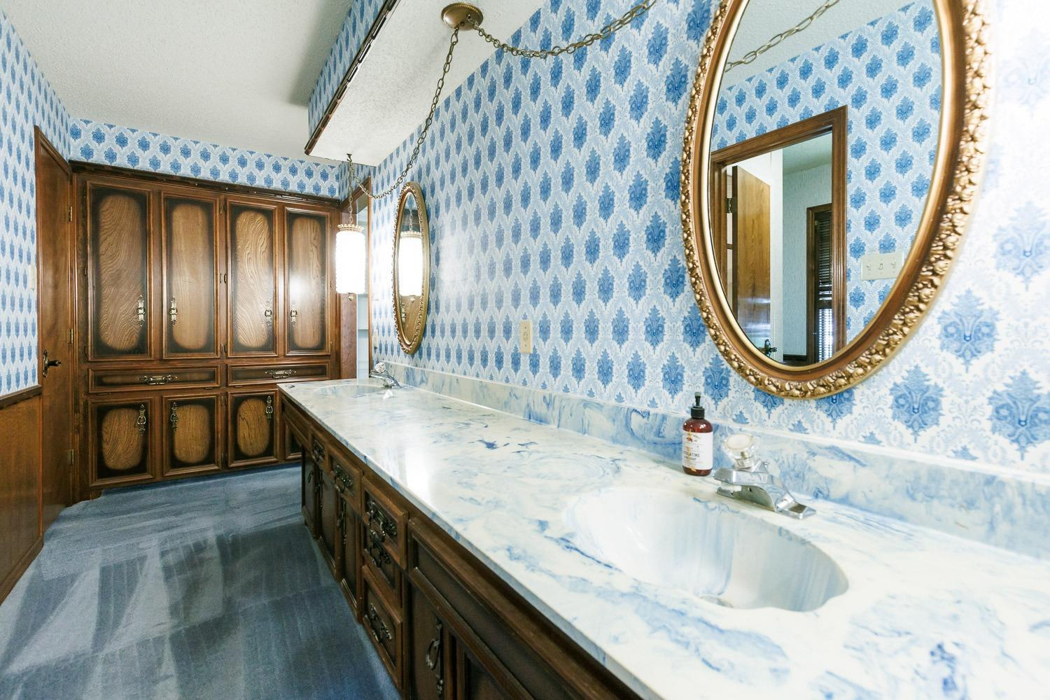 3402 79th Street Lubbock, TX 79423 - Photo 26 of 49 a bathroom with a granite countertop sink a mirror and a bathtub