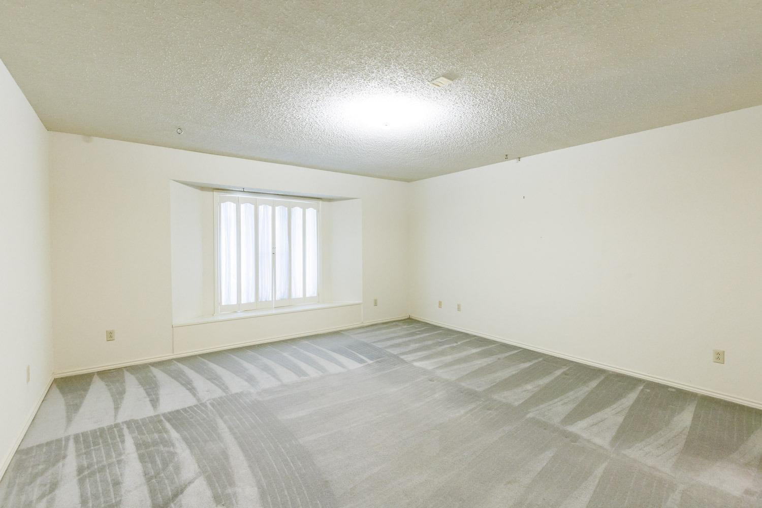 3402 79th Street Lubbock, TX 79423 - Photo 36 of 49 an empty room with a window