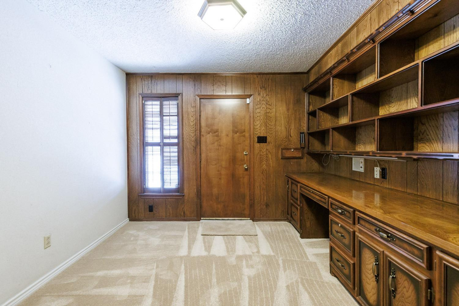 3402 79th Street Lubbock, TX 79423 - Photo 38 of 49 a hallway with a large window