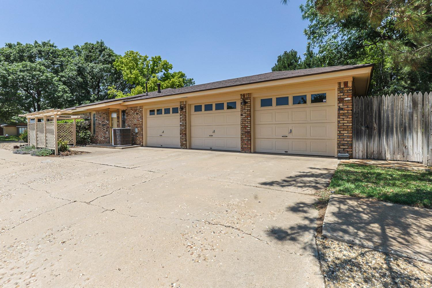 3402 79th Street Lubbock, TX 79423 - Photo 49 of 49 a front view of a house with a yard