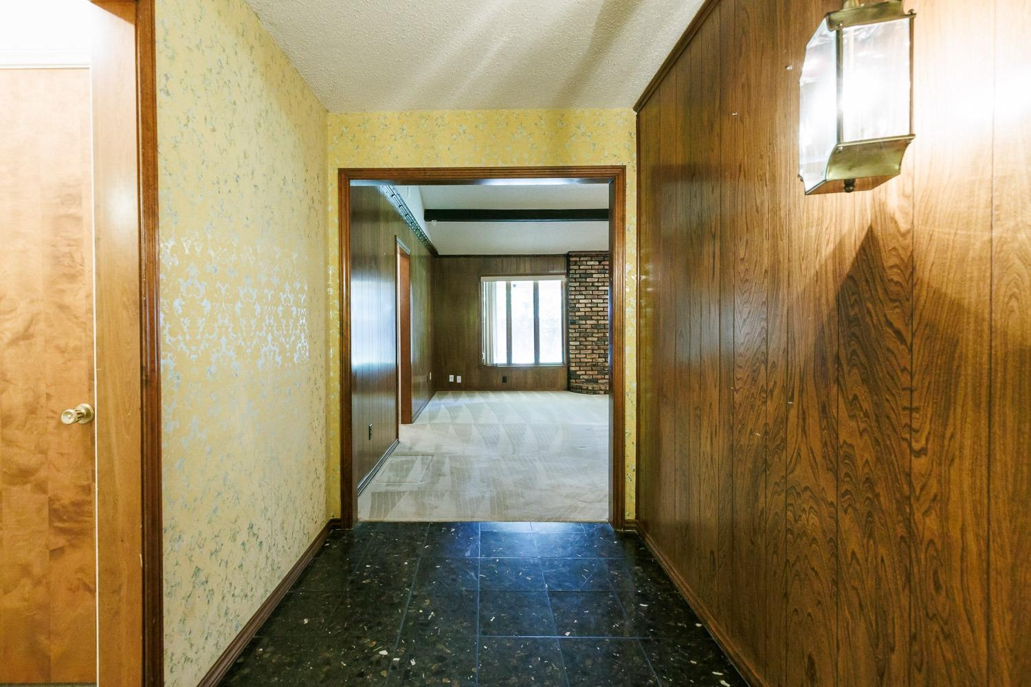 3402 79th Street Lubbock, TX 79423 - Photo 5 of 49 a view of a hallway with wooden floor and glass door