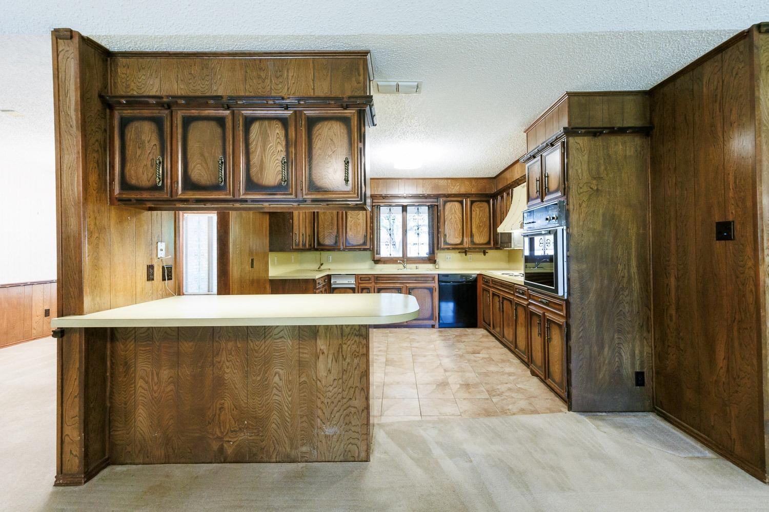 3402 79th Street Lubbock, TX 79423 - Photo 9 of 49 a kitchen with stainless steel appliances granite countertop a refrigerator and a sink