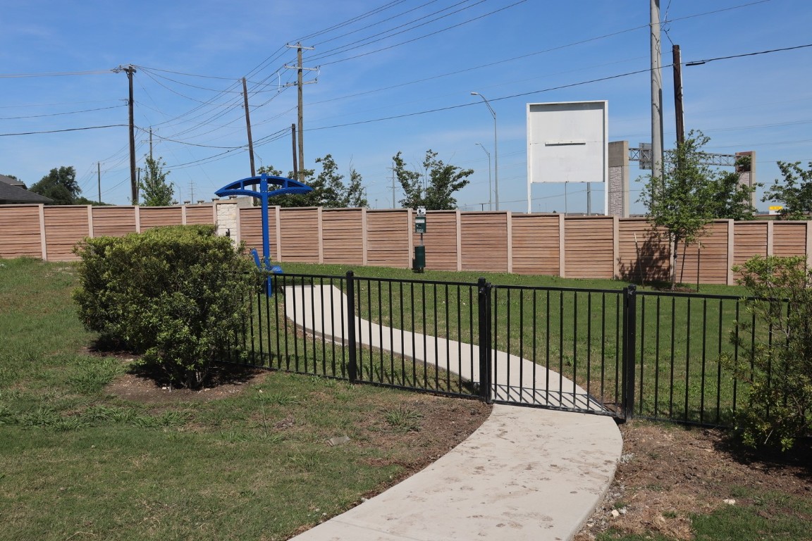 18909 Schultz Lane, Unit 1002 Round Rock, TX 78664 - Photo 6 of 24 a view of a wrought iron fences in front of house