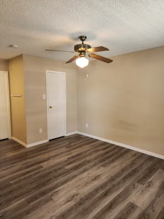 a kitchen with a refrigerator and a sink