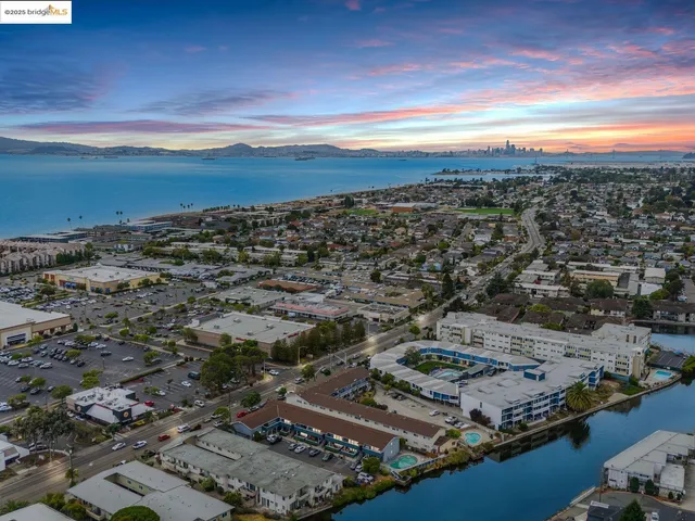 an aerial view of residential building with ocean view
