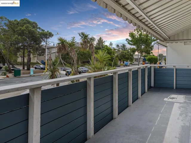 a view of a balcony with an outdoor space