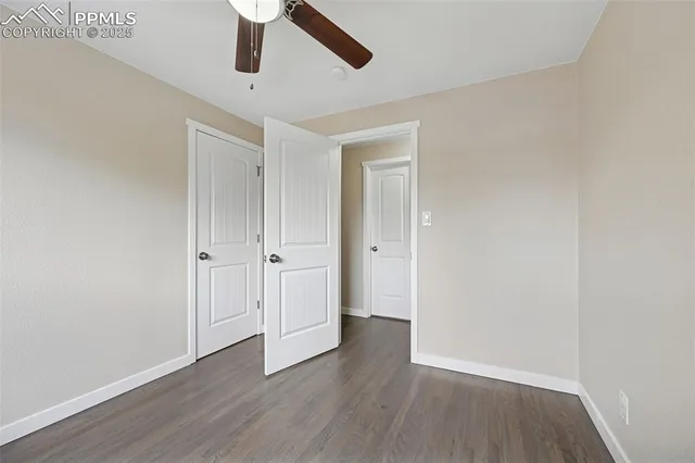 a white bath tub sitting next to a white sink and a toilet