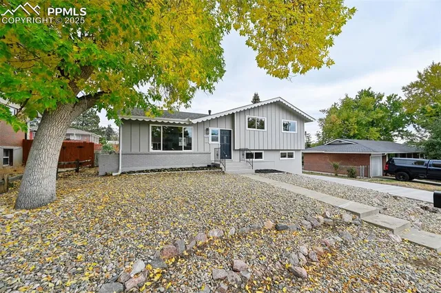 a house with trees in the background