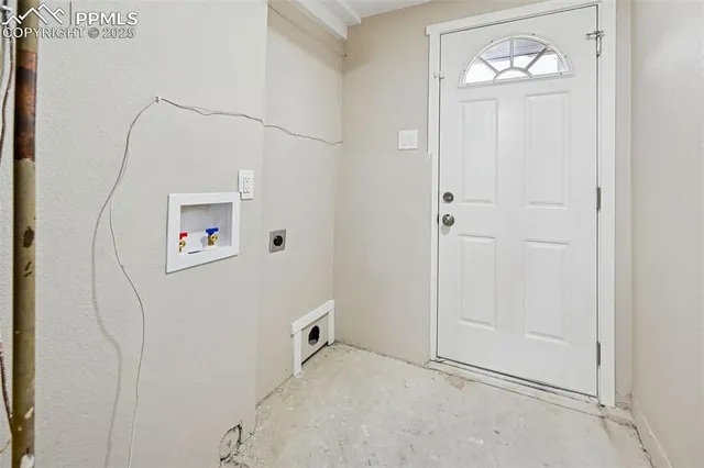 an empty room with a empty space and windows