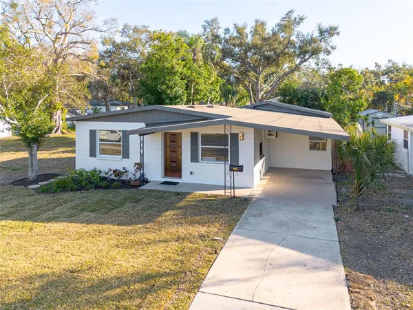 front view of a house with a yard