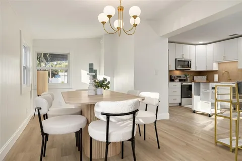 a view of kitchen and dining area with furniture