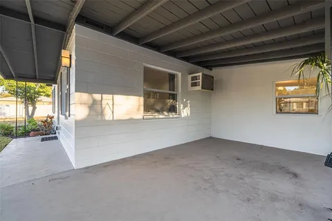 a view of an empty room with a fireplace