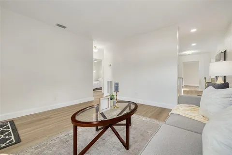 a living room with furniture and a table