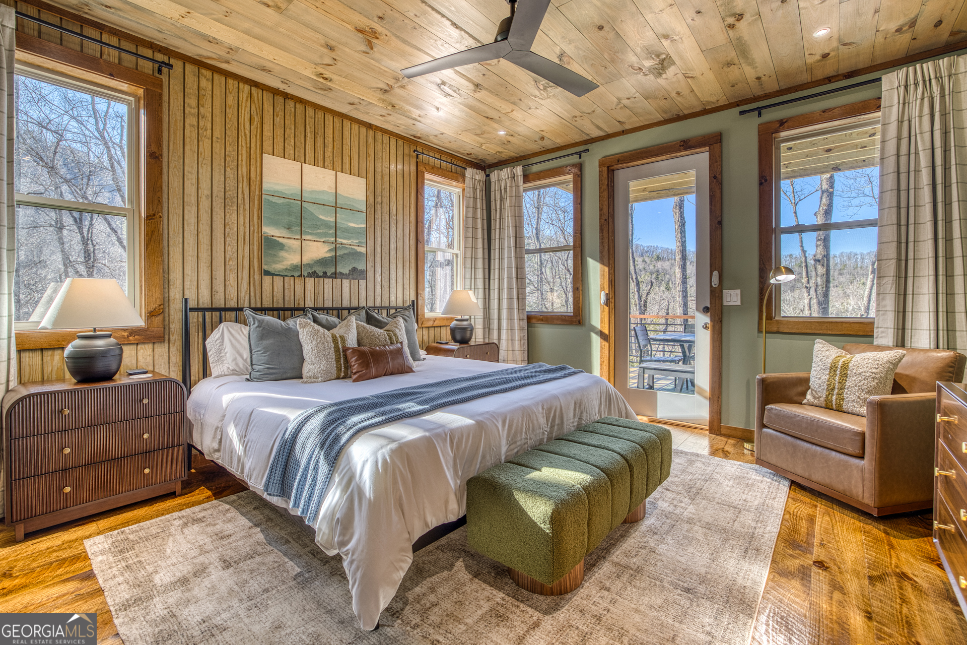 1160 Mangum's Trail Blue Ridge, GA 30513 - Photo 25 of 75 a spacious bedroom with a bed couch and a large window