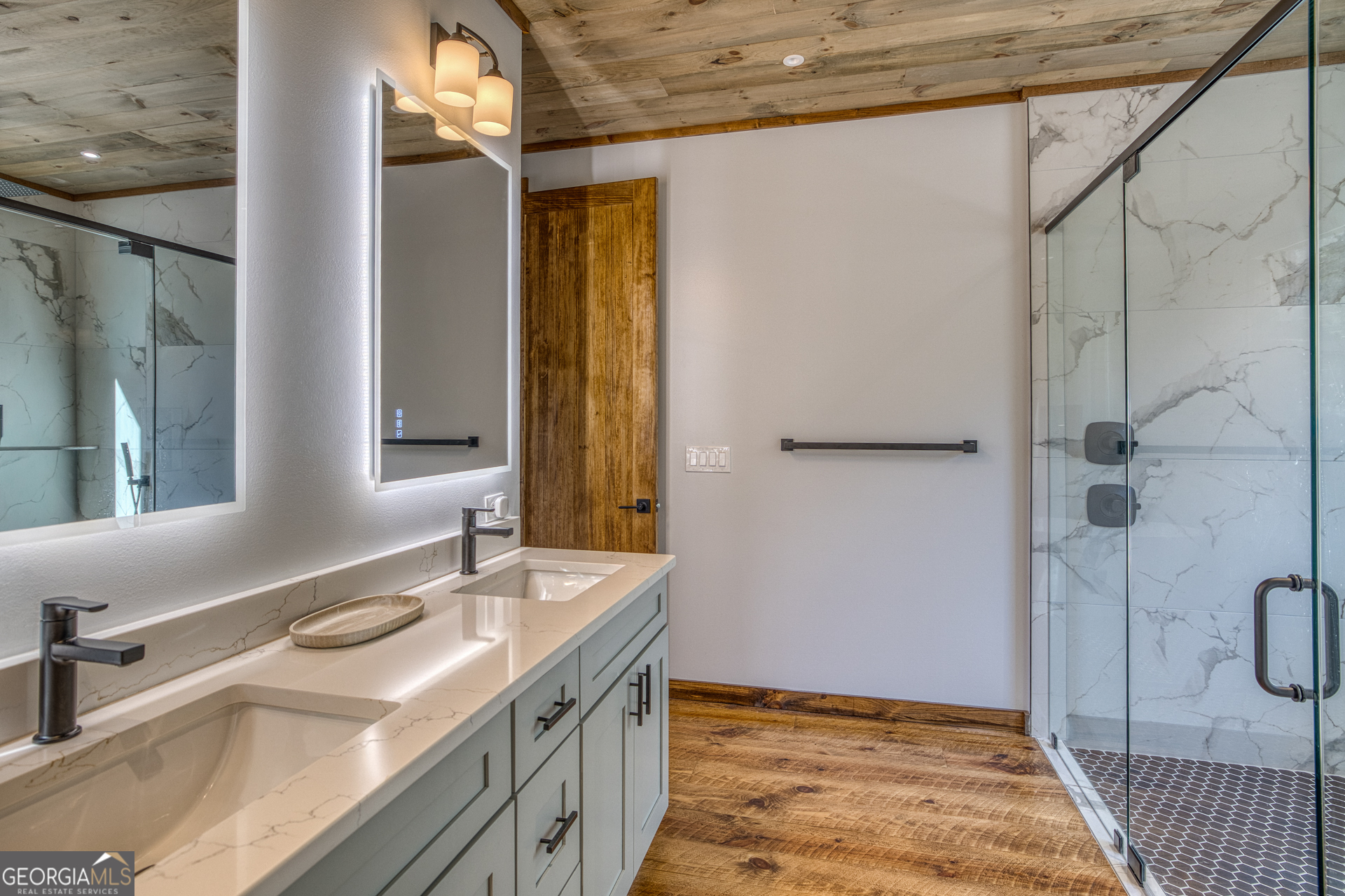 1160 Mangum's Trail Blue Ridge, GA 30513 - Photo 27 of 75 a bathroom with a sink and a mirror