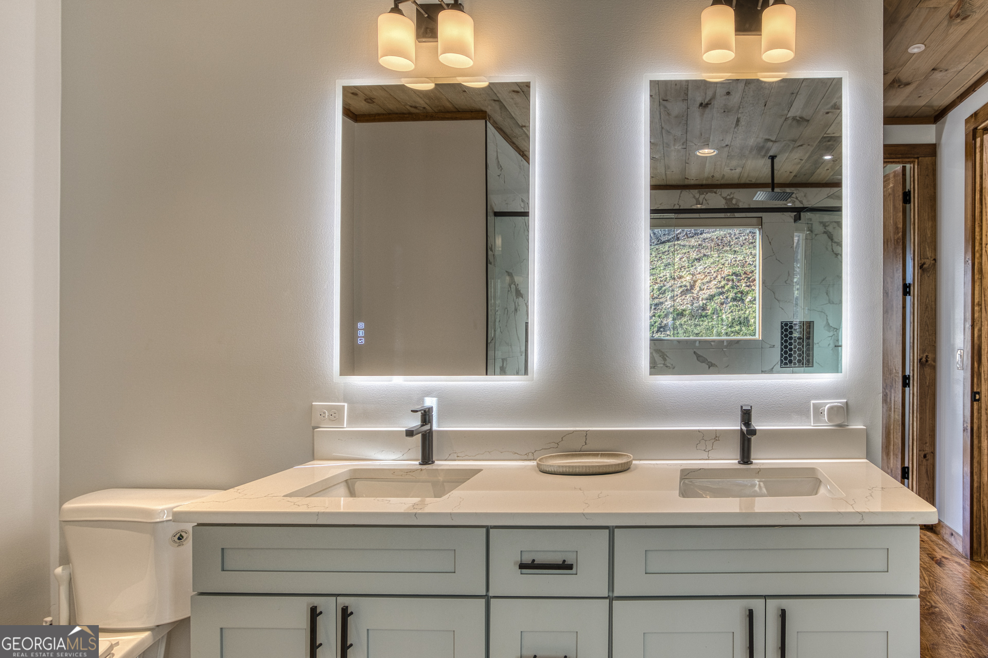 1160 Mangum's Trail Blue Ridge, GA 30513 - Photo 28 of 75 a bathroom with a sink and a mirror