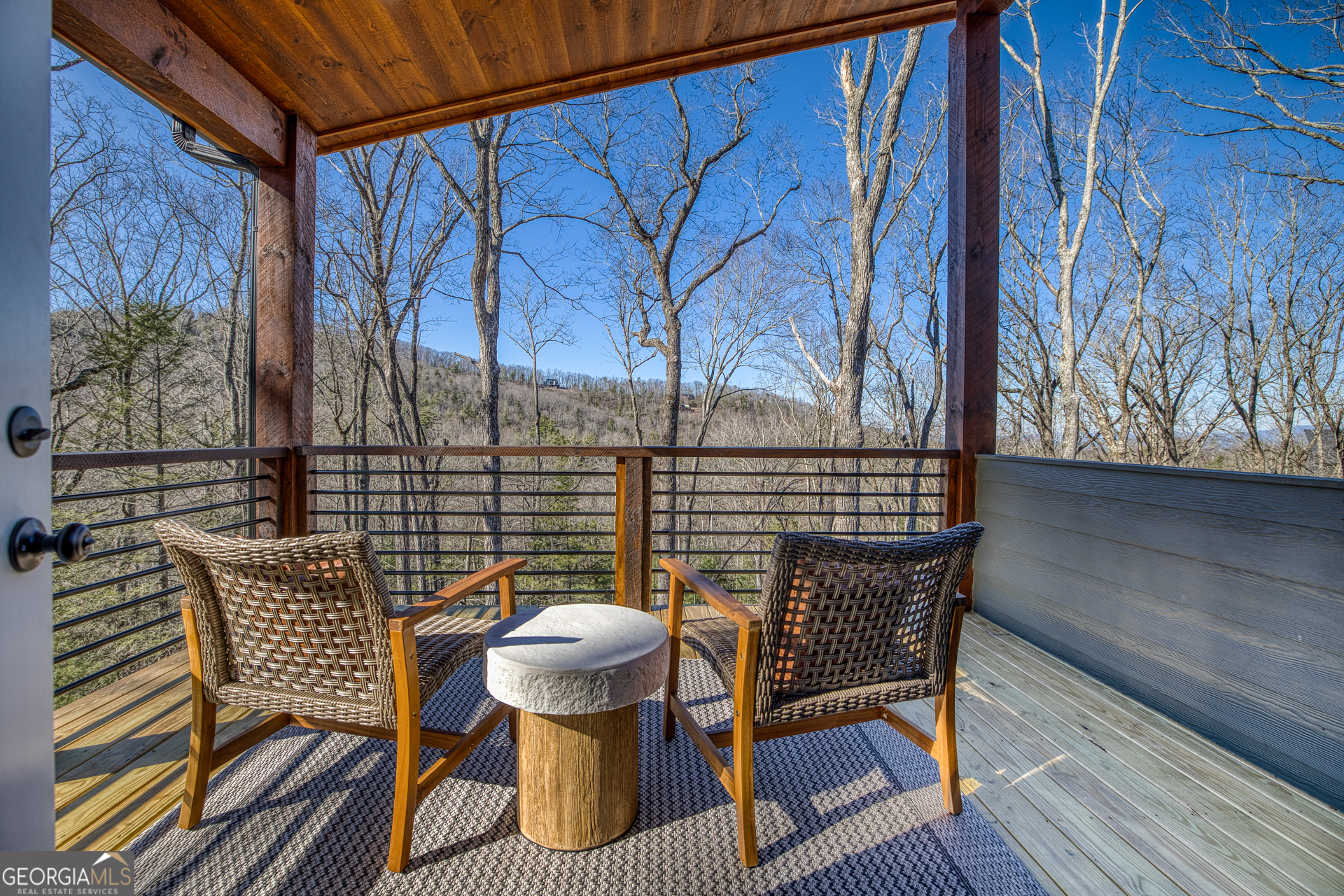 1160 Mangum's Trail Blue Ridge, GA 30513 - Photo 34 of 75 a view of balcony with wooden floor and outdoor seating