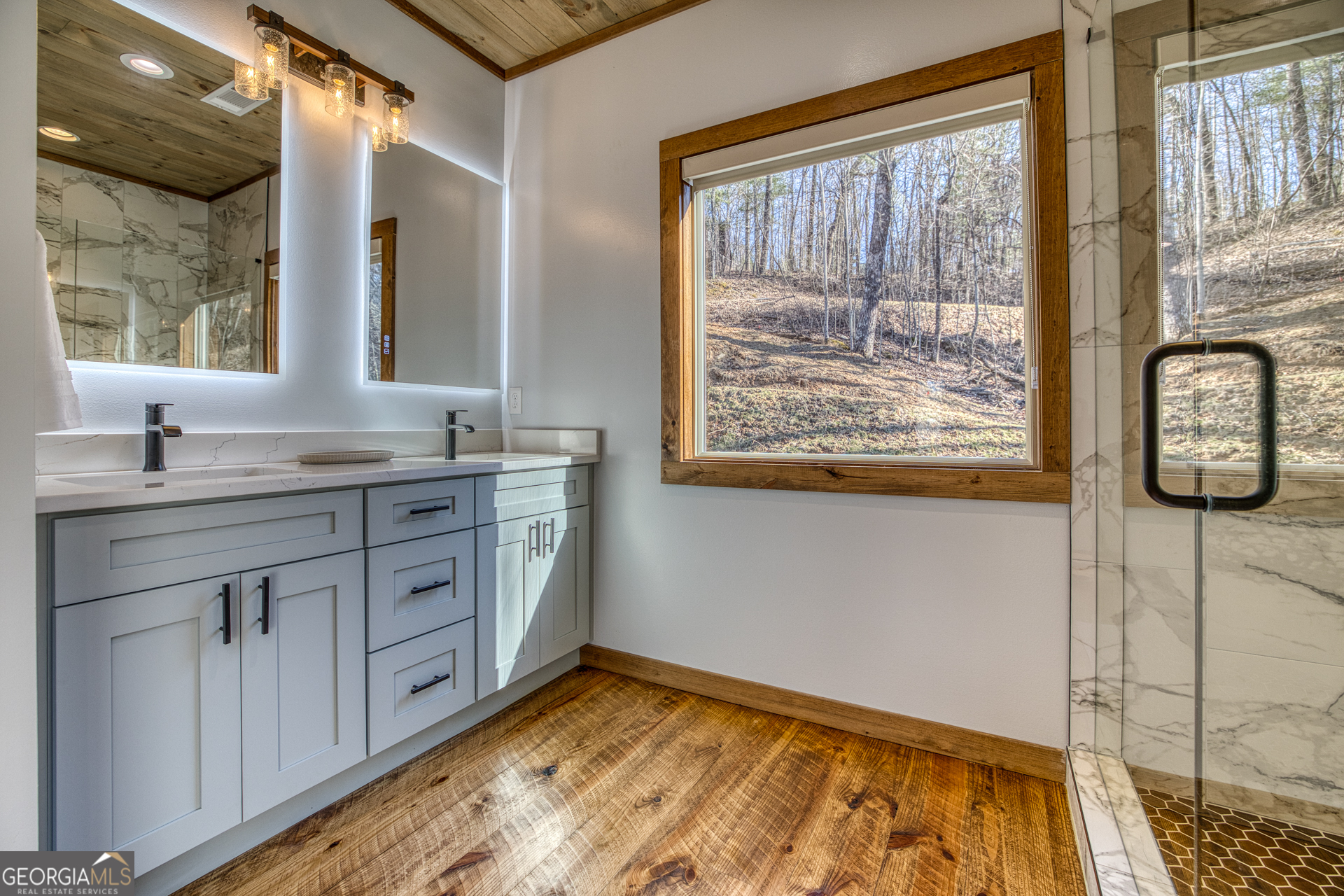 1160 Mangum's Trail Blue Ridge, GA 30513 - Photo 38 of 75 a bathroom with a sink and a mirror