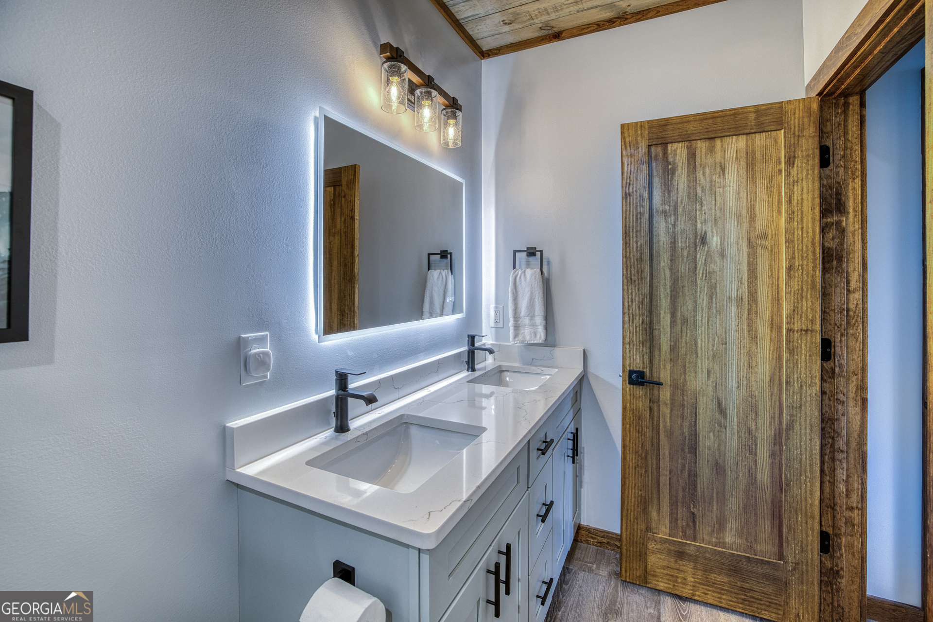 1160 Mangum's Trail Blue Ridge, GA 30513 - Photo 50 of 75 a bathroom with a sink a mirror and a vanity